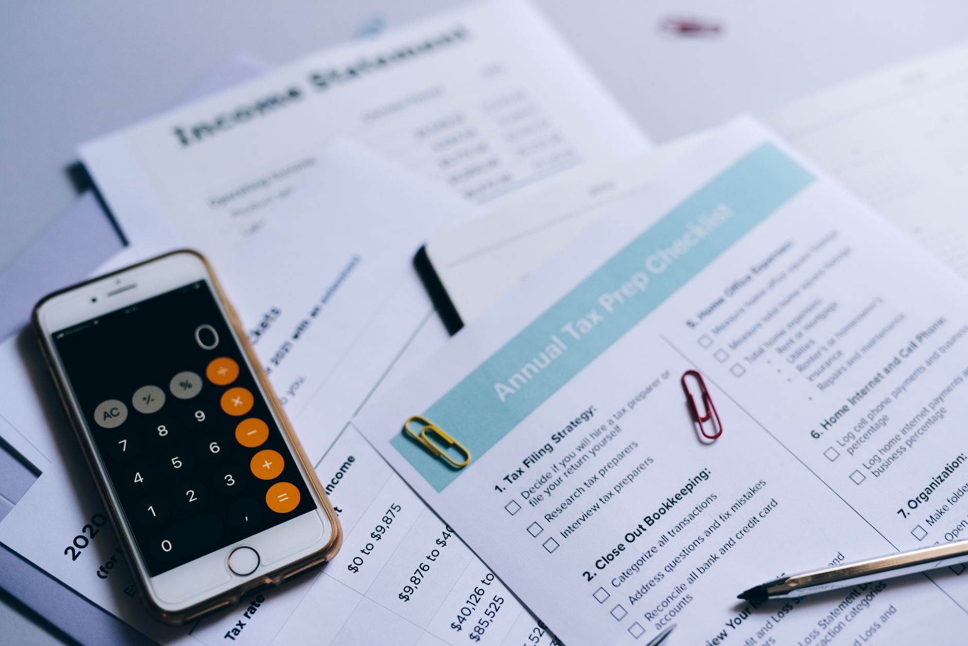 Close-up of property tax assessment documents and calculator on a desk, representing home ownership costs and financial planning
