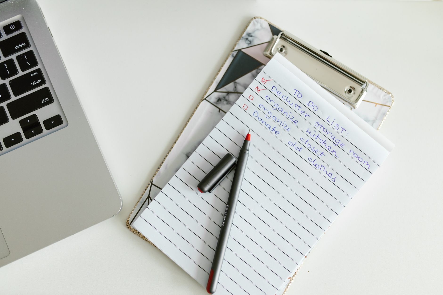 homeowner reviewing inspection checklist with clipboard in newly purchased house