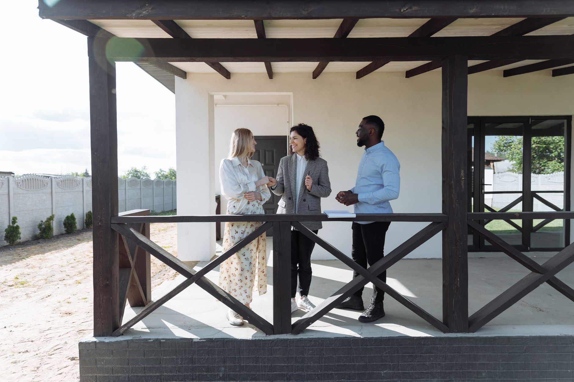 Real estate agent discussing commission structure and contract terms with buyer client in modern office setting
