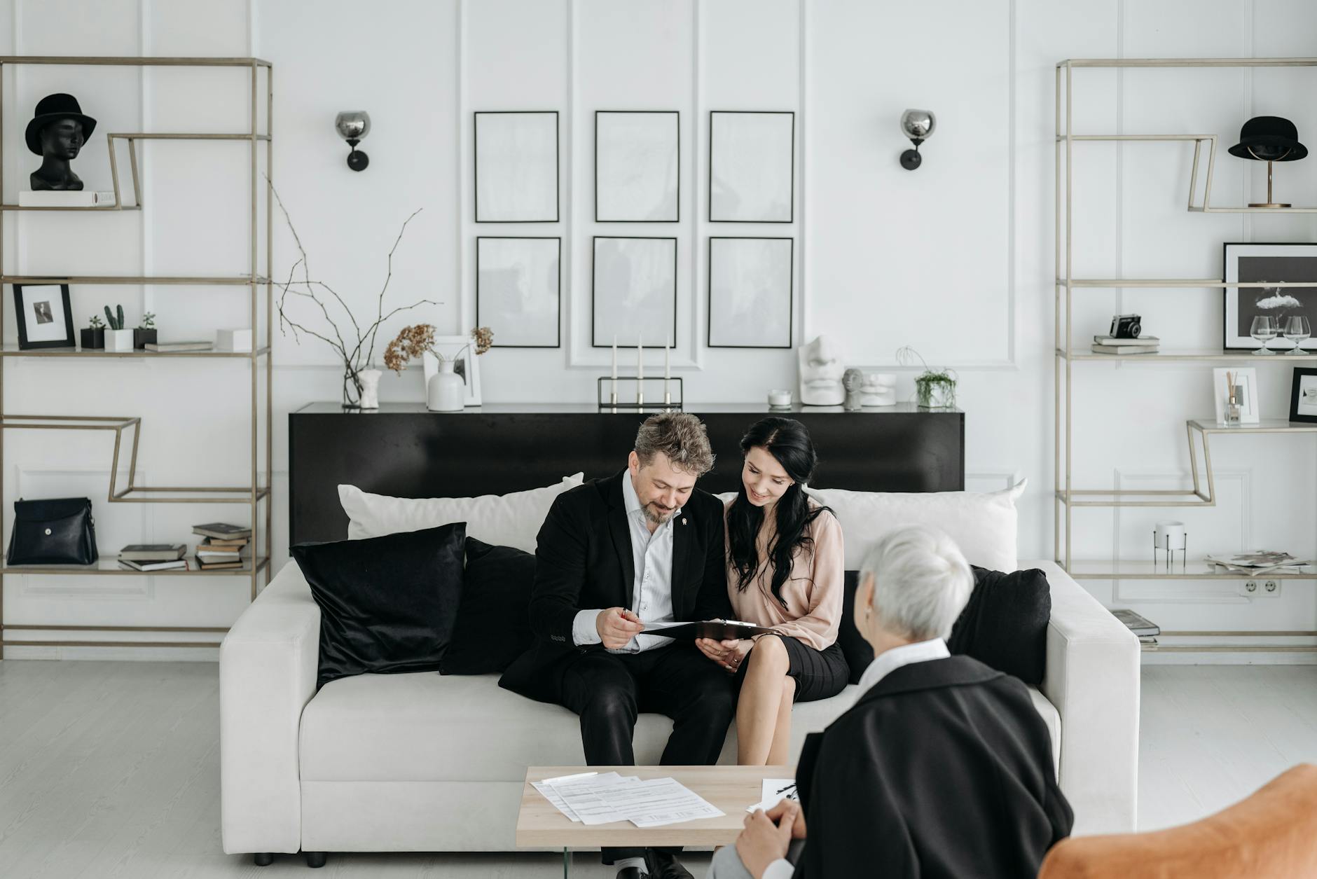 Korean family reviewing mortgage and property tax documents at home with calculator and paperwork