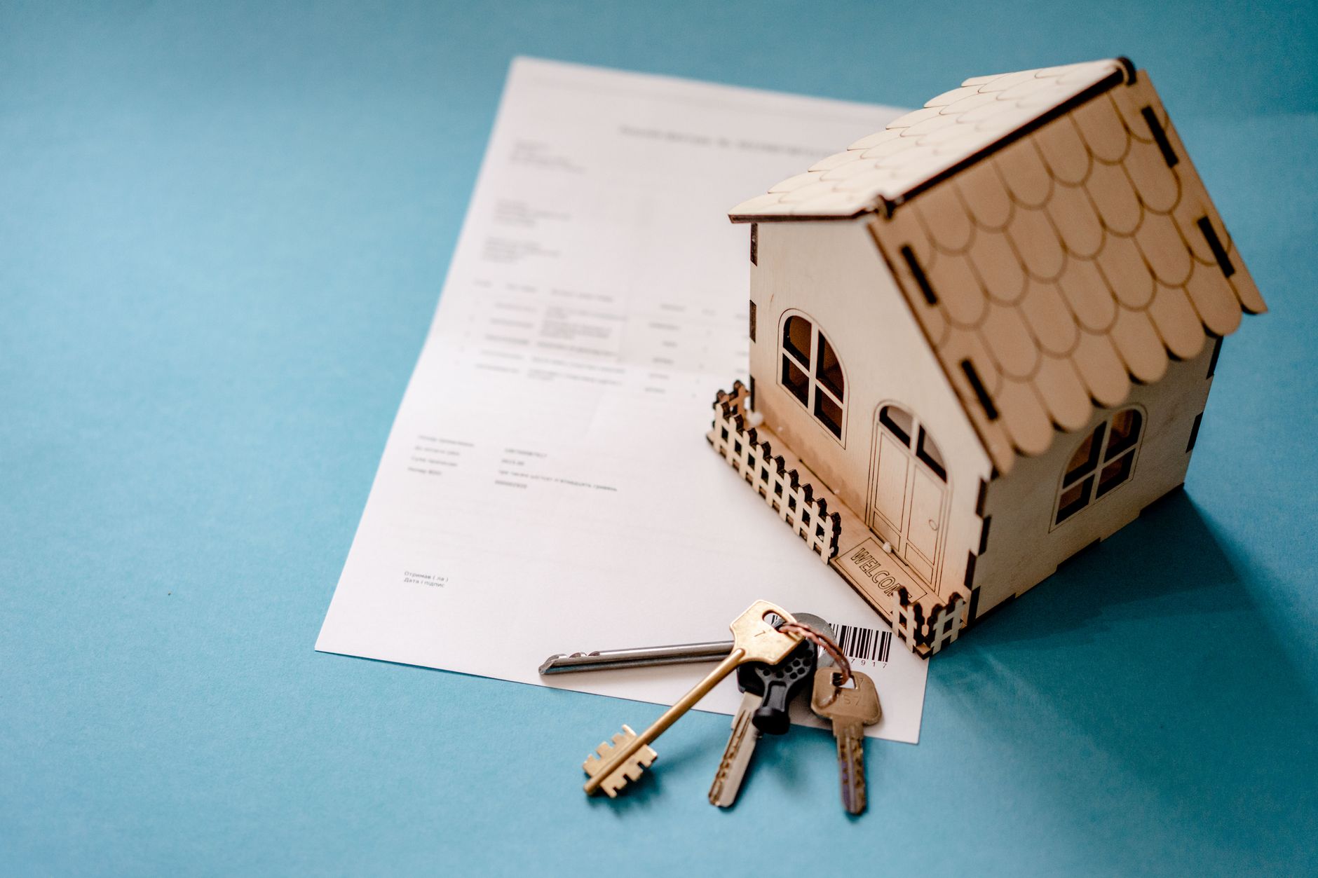 Real estate agent comparing property documents and contracts at desk with state information