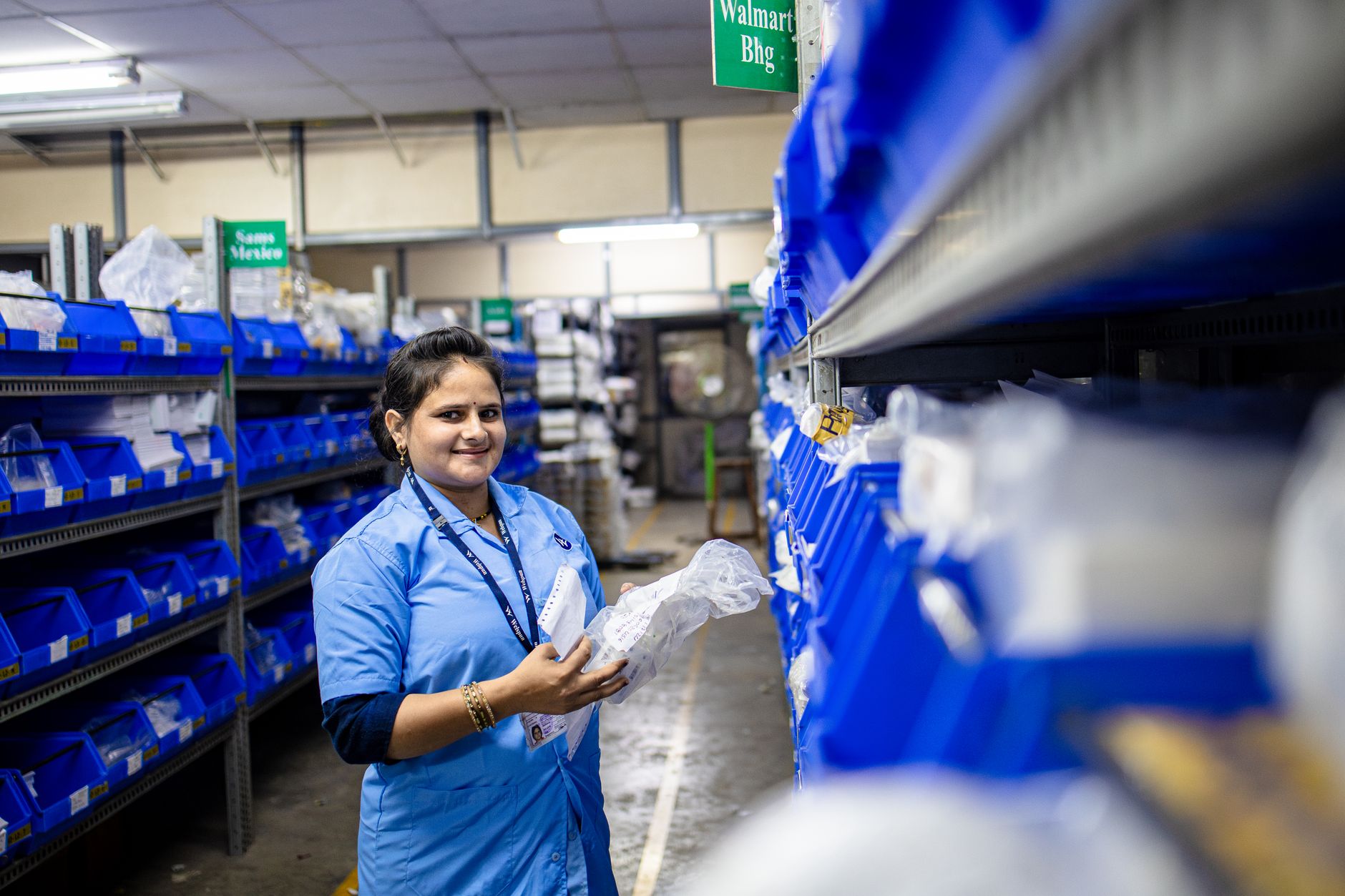 warehouse team efficiently sorting and processing returned holiday merchandise on conveyor systems
