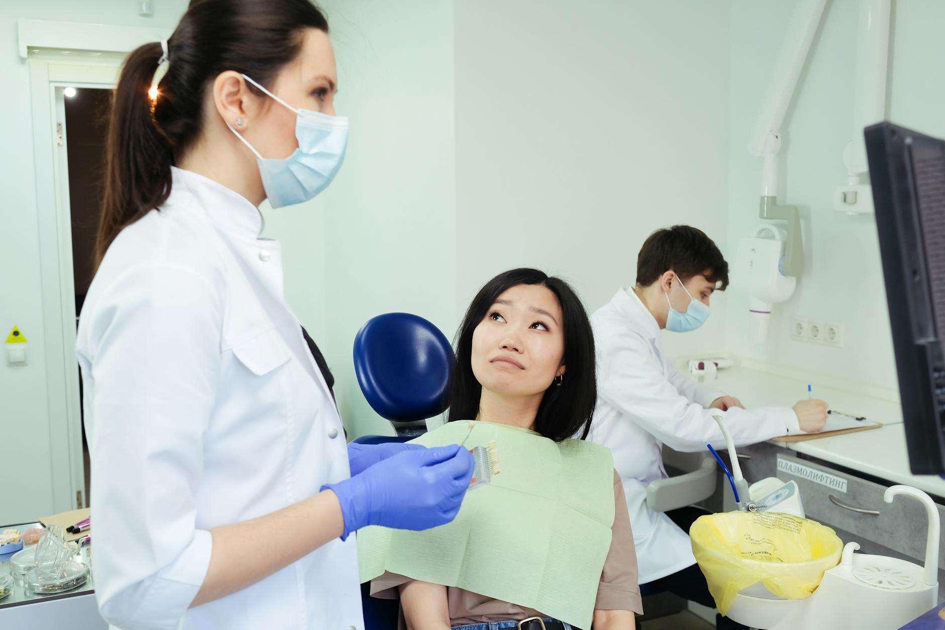 Orthodontist showing treatment plan to patient during consultation visit