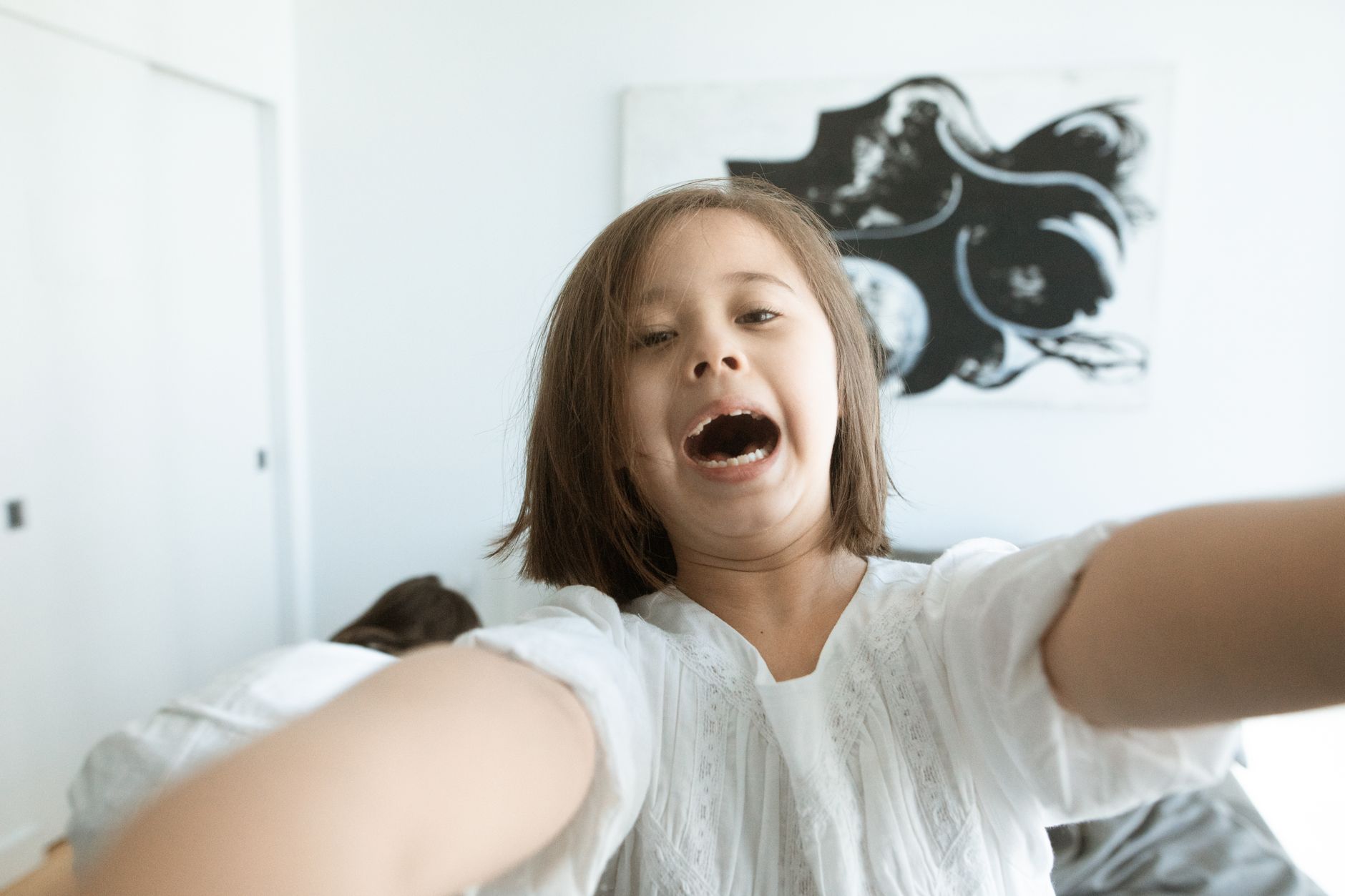 Young child with open mouth breathing during orthodontic examination by specialist
