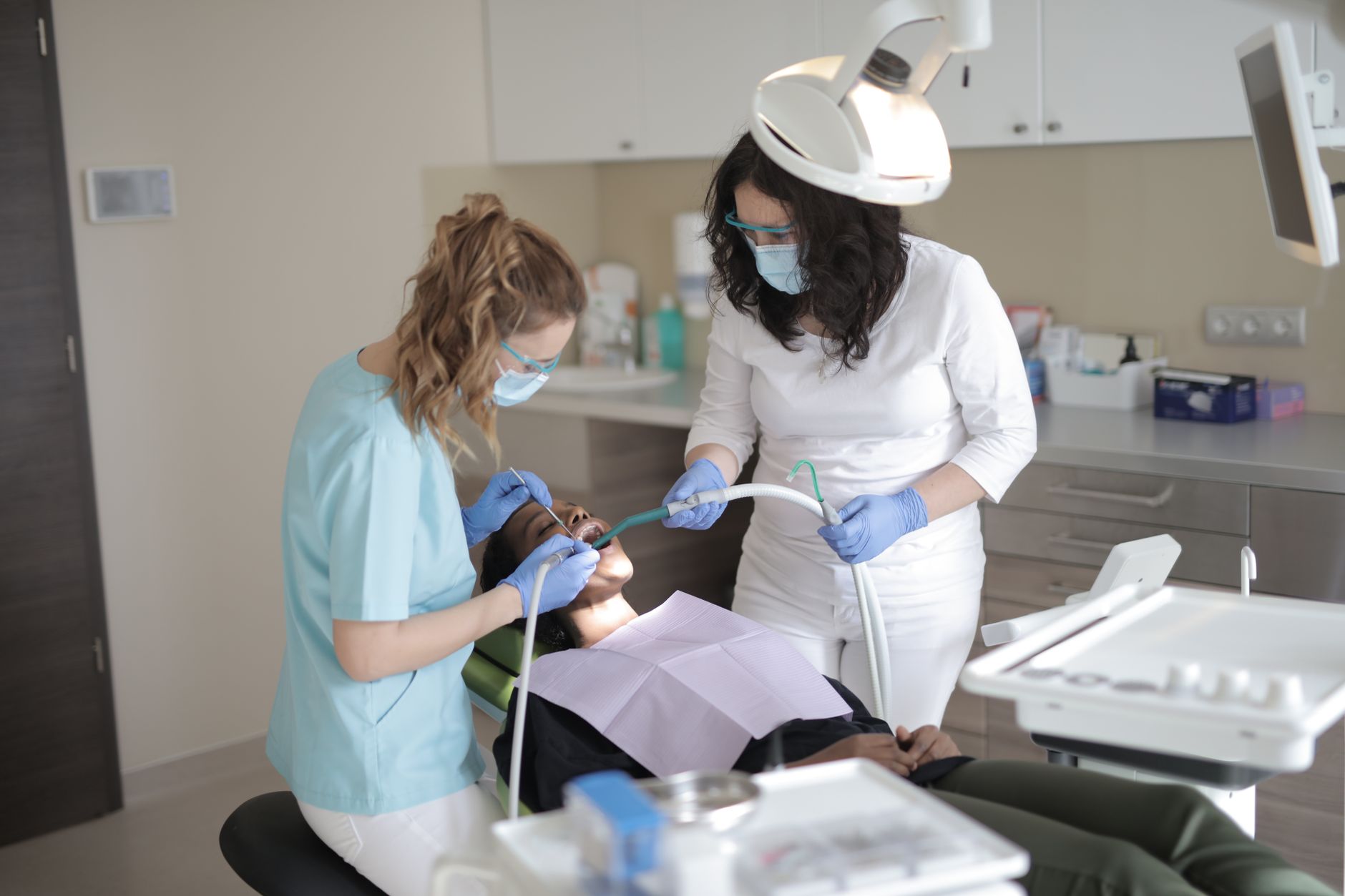 Patient communicating with Spanish-speaking dentist during dental consultation appointment