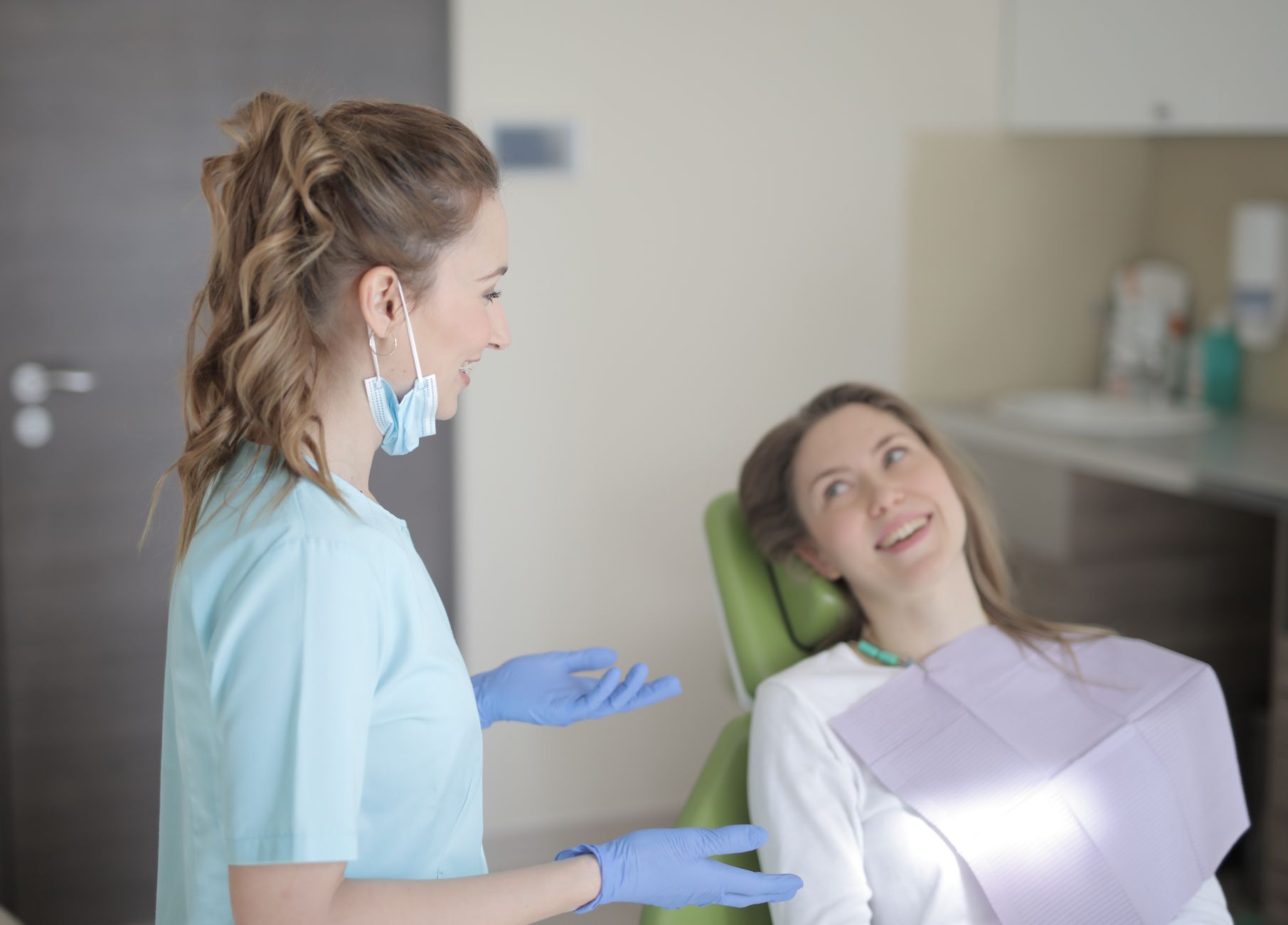 Invisalign clear aligner tray being shown to patient during dental consultation appointment