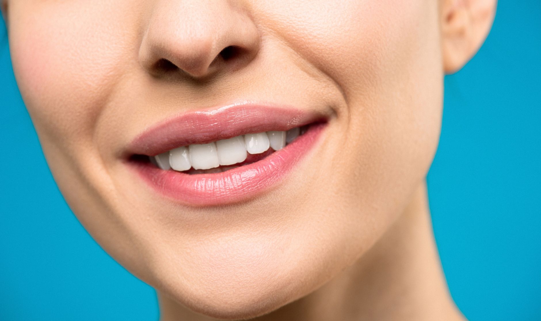 Close-up of person with missing tooth showing dental gap in smile