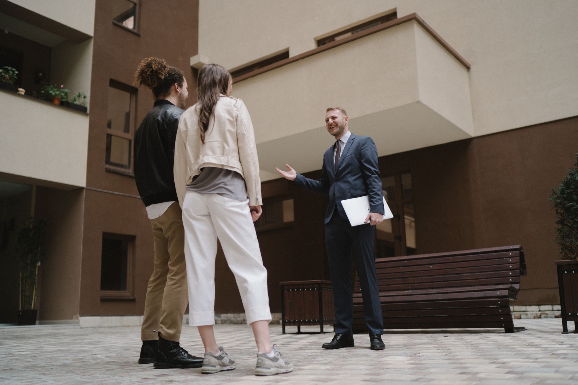 tenant reviewing documents with landlord in apartment regarding housing conditions