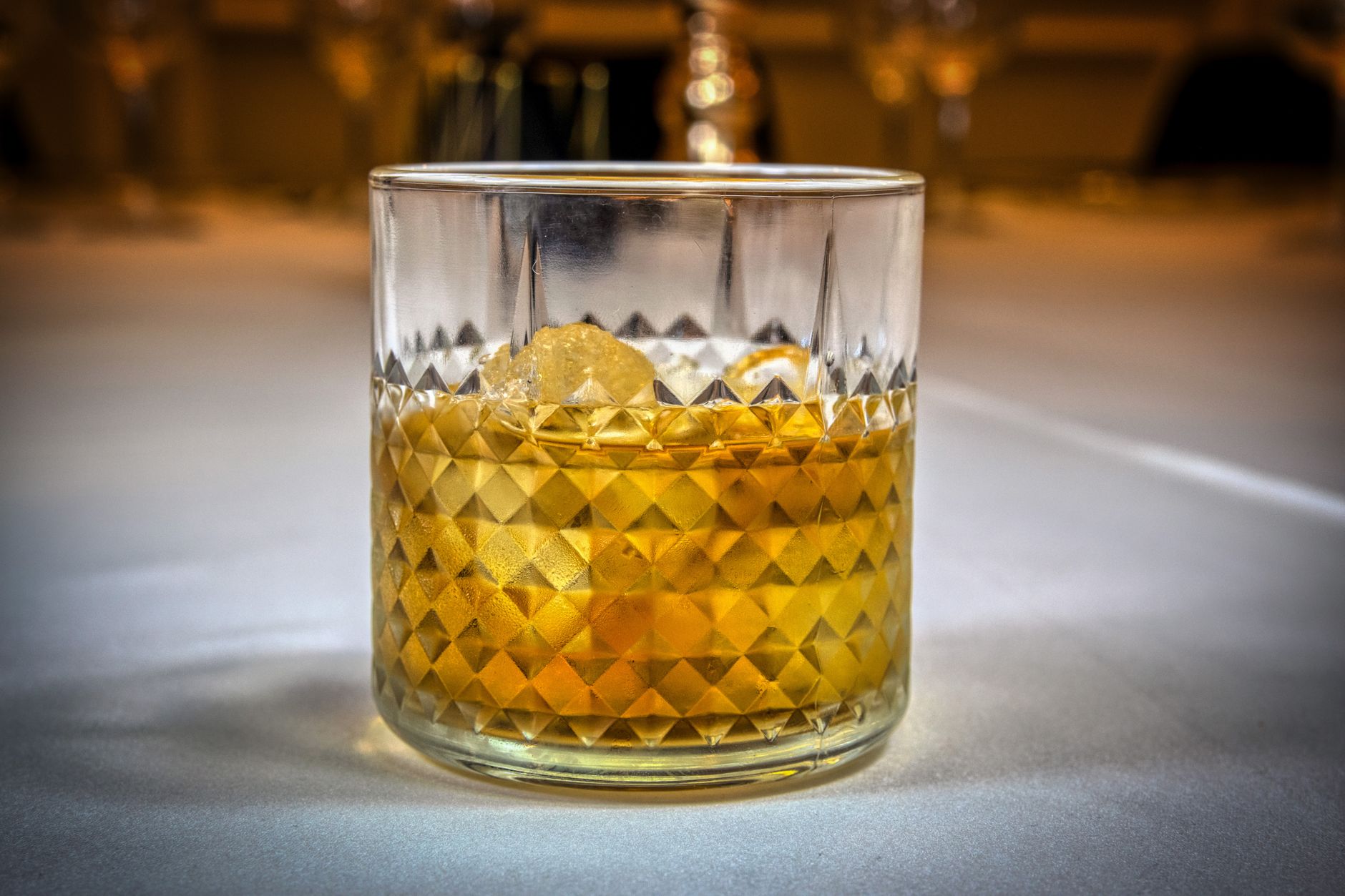 A whisky highball cocktail served in a tall glass with ice and soda, showcasing modern bar culture and premium spirit presentation