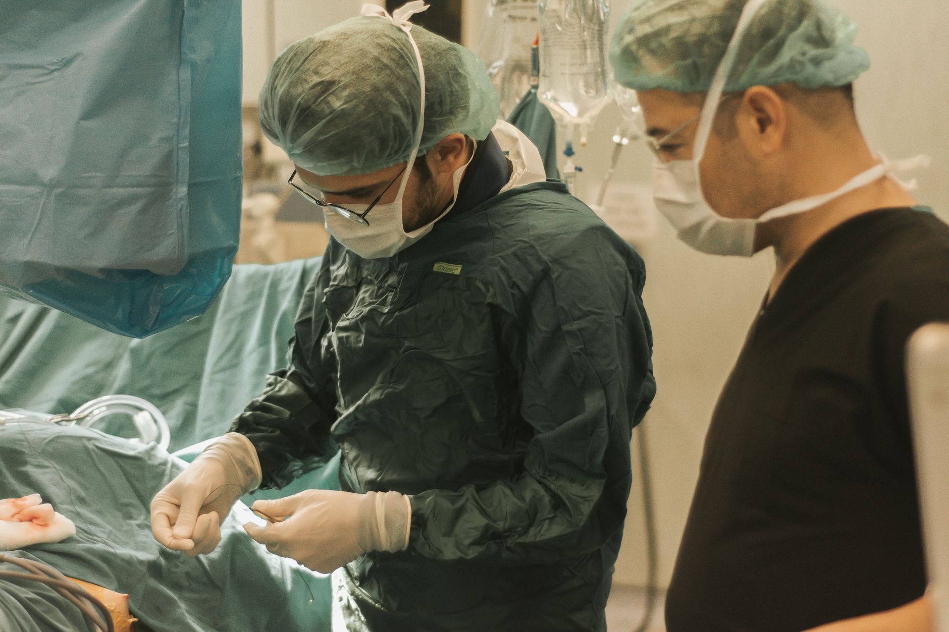 Surgeon discussing tummy tuck and liposuction options with patient during consultation