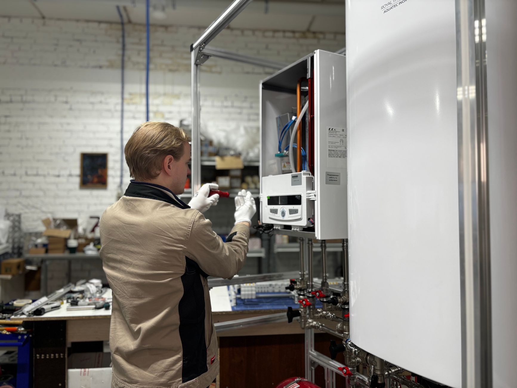 Professional plumber installing a new water heater in a residential basement