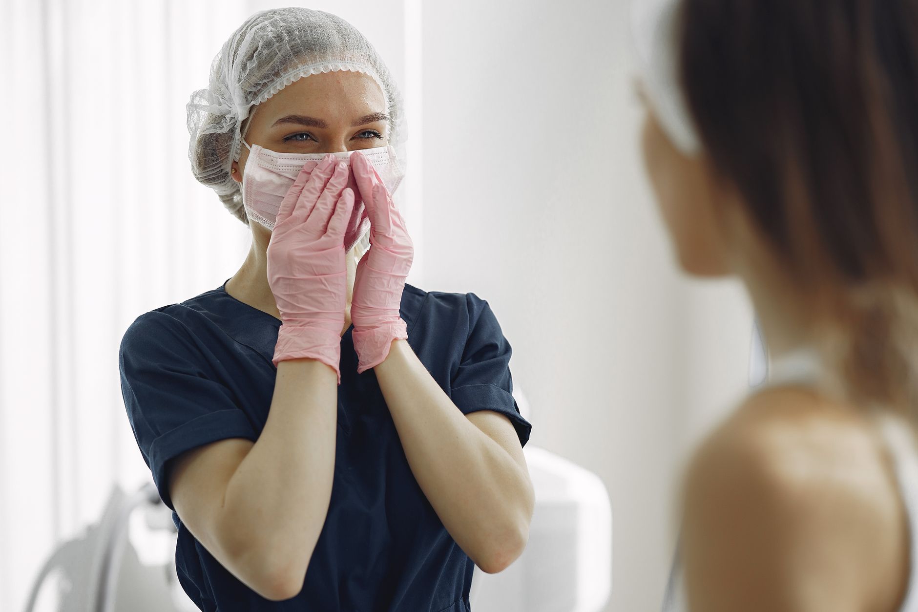 Woman consulting with cosmetic surgeon about mommy makeover procedures and treatment options