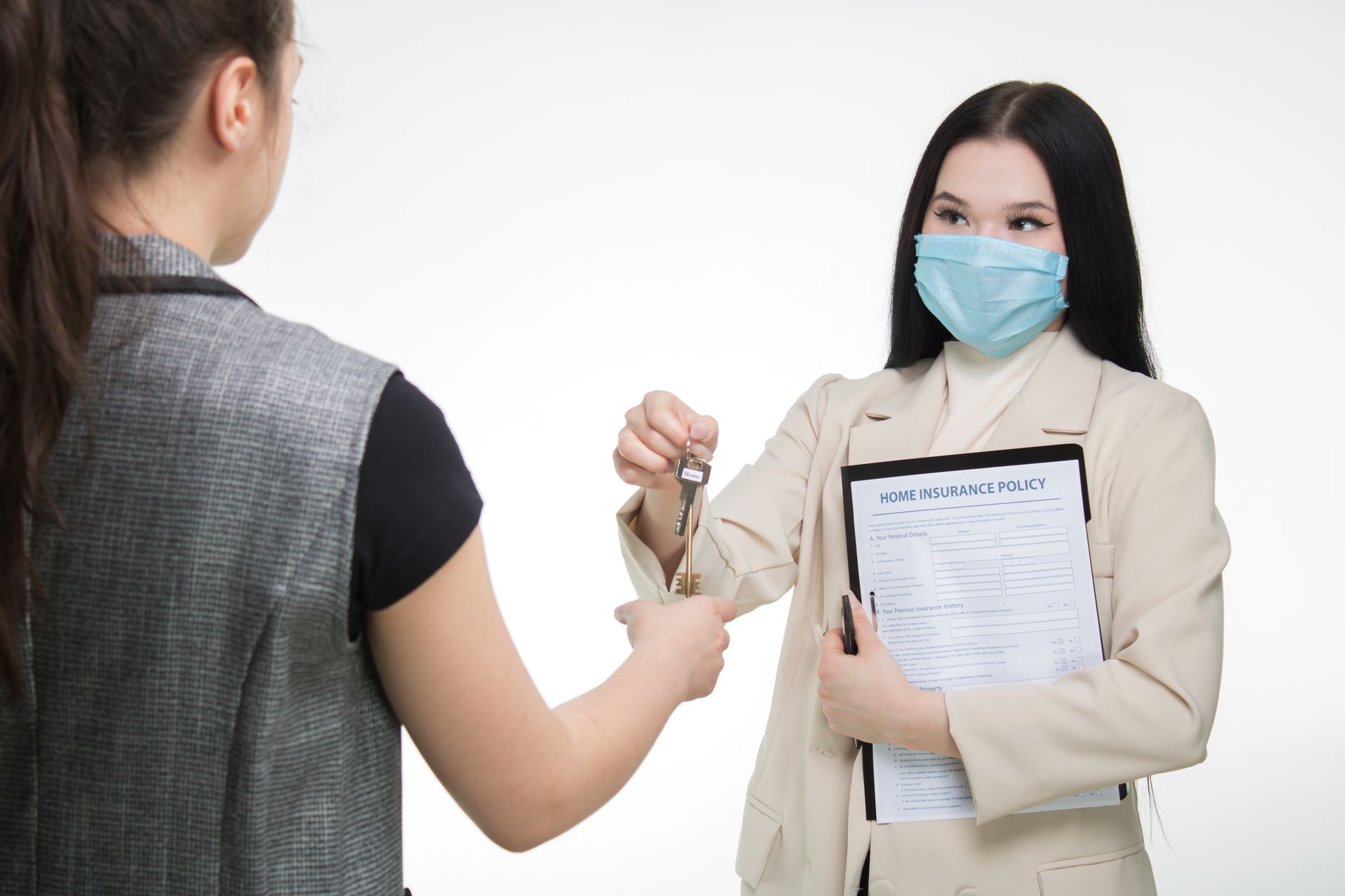 Insurance agent discussing policy options with client at desk versus person independently comparing insurance online
