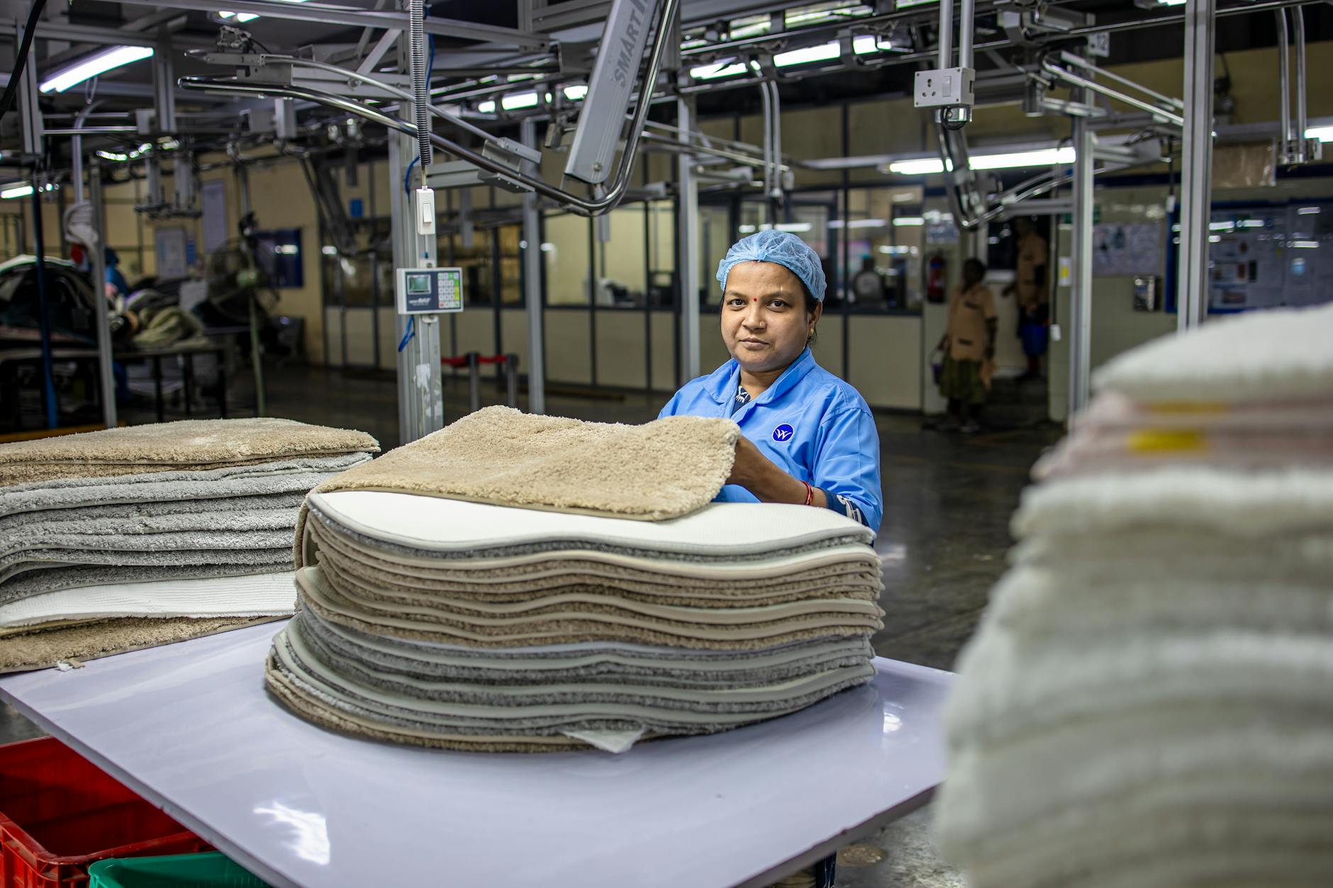 Shift supervisor monitoring production quality and worker accountability on manufacturing floor