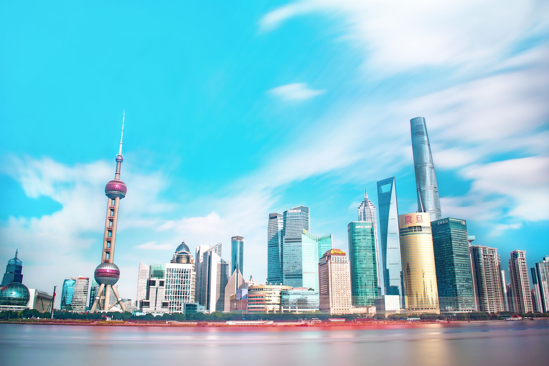 Global real estate investors and legal professionals collaborating on cross-border property investment strategy