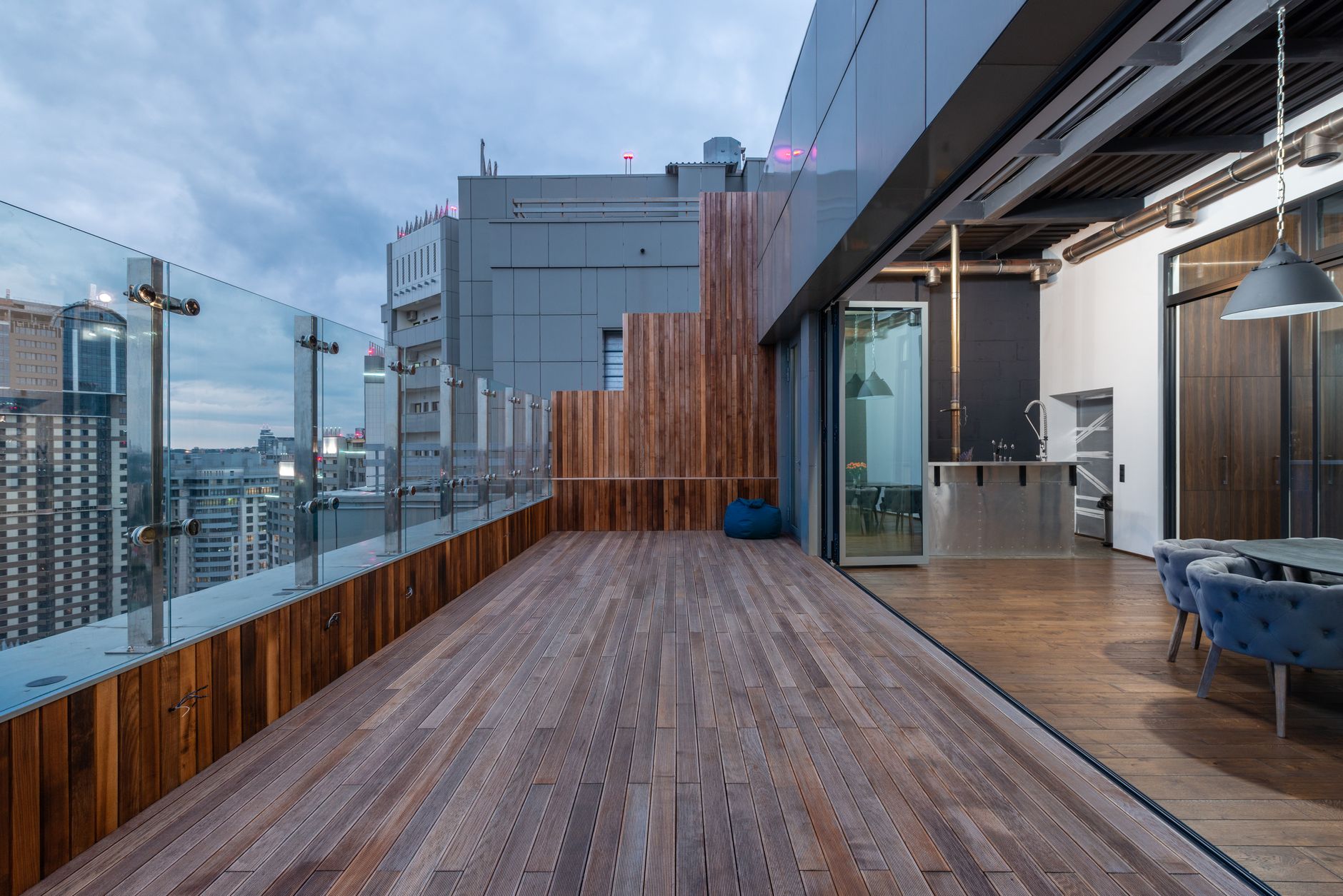 Modern luxury apartment with floor-to-ceiling windows overlooking New York City skyline and Manhattan buildings