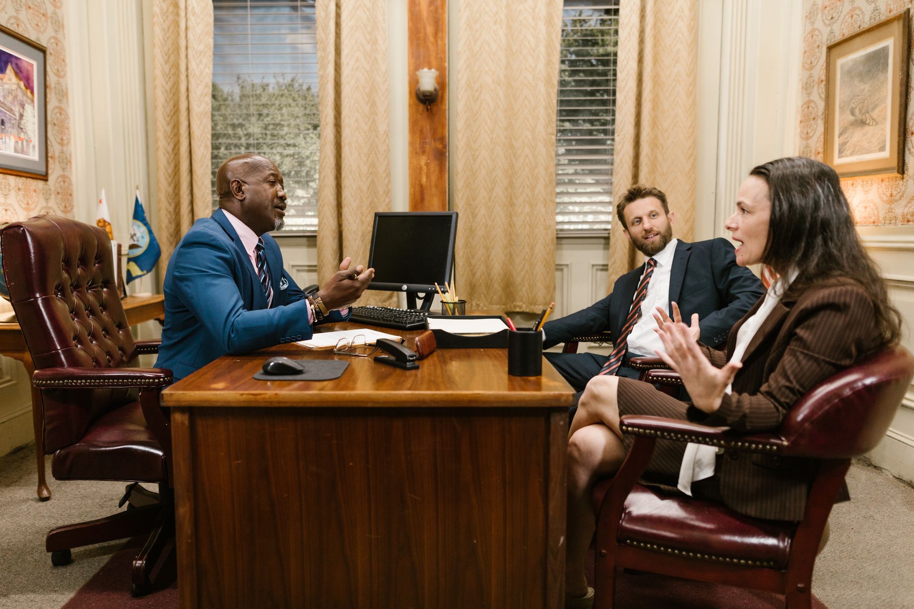 Personal injury lawyer consulting with client in modern office setting