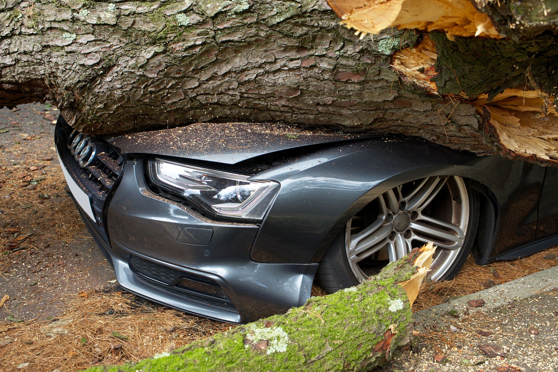 Damaged rideshare vehicle after accident with insurance claim documentation visible