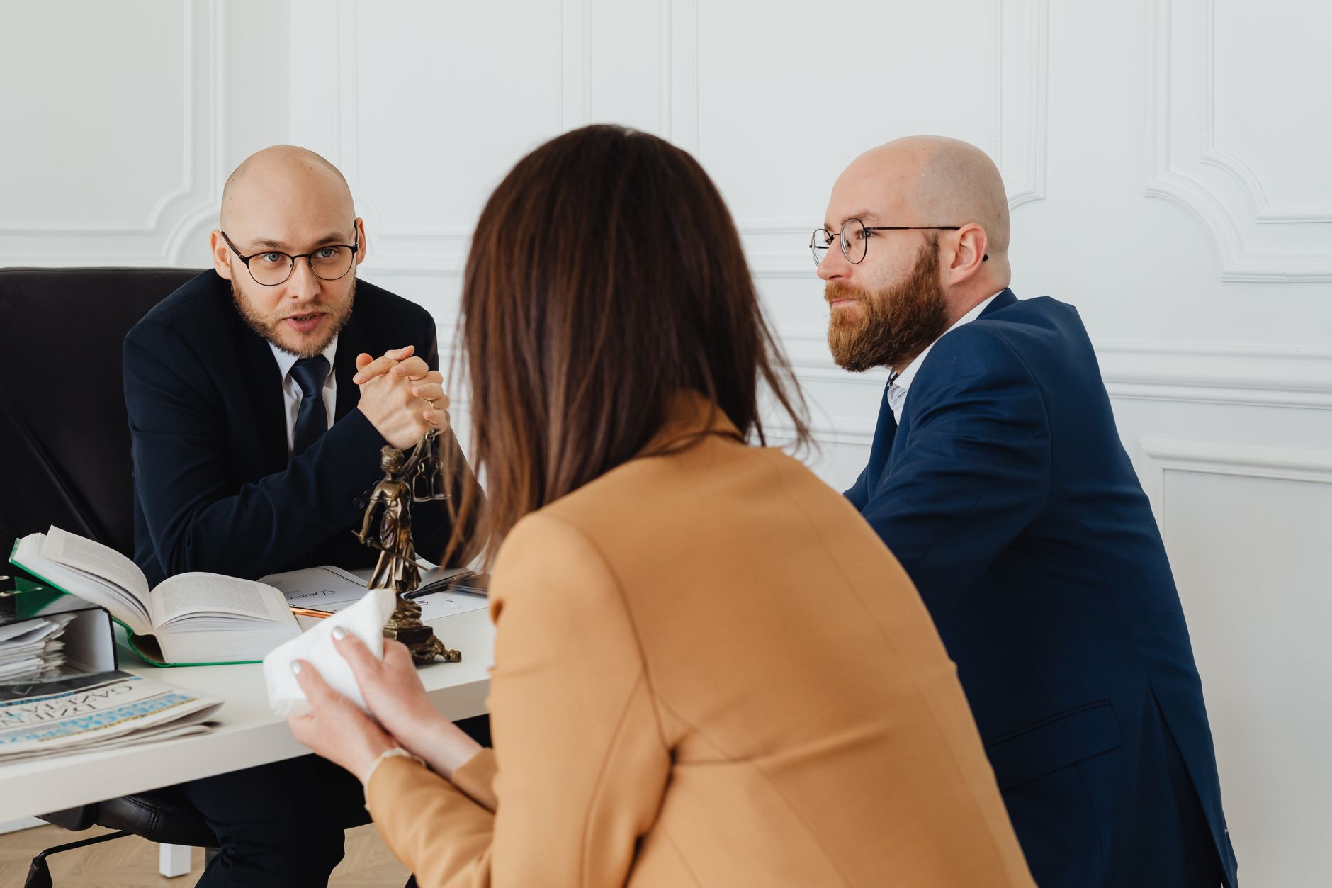 Client and lawyer discussing legal matters during a professional consultation meeting in an office