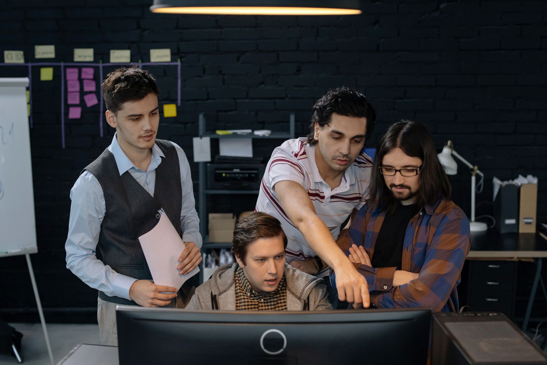 Agency team members coordinating multiple brand campaigns and creator partnerships at a collaborative workspace