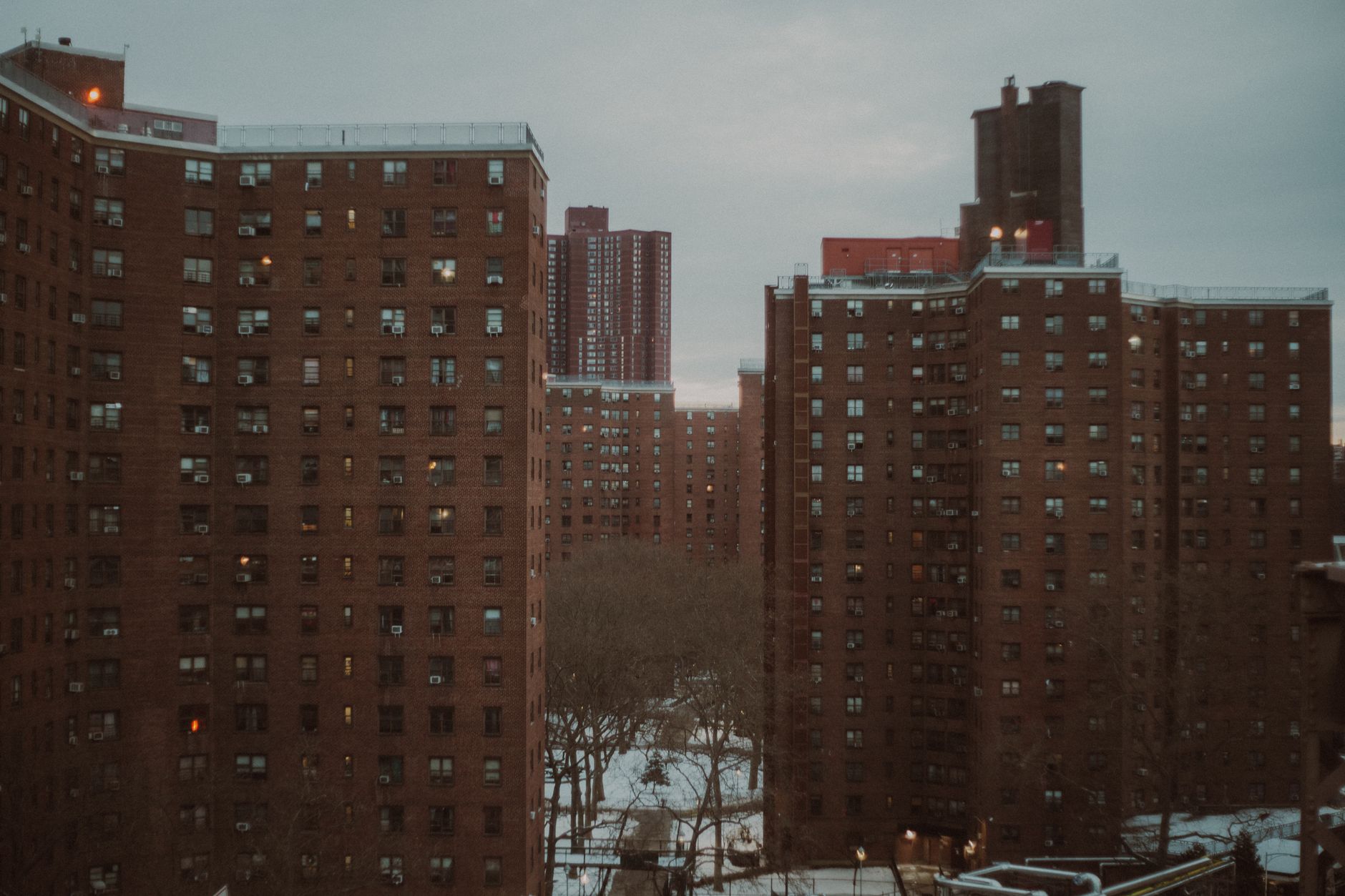 Modern Brooklyn multifamily apartment building with brick facade and street view