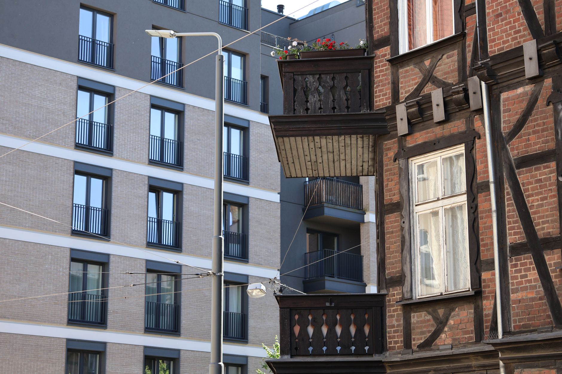 Modern mixed-use building with ground-floor retail and residential units above in Brooklyn neighborhood