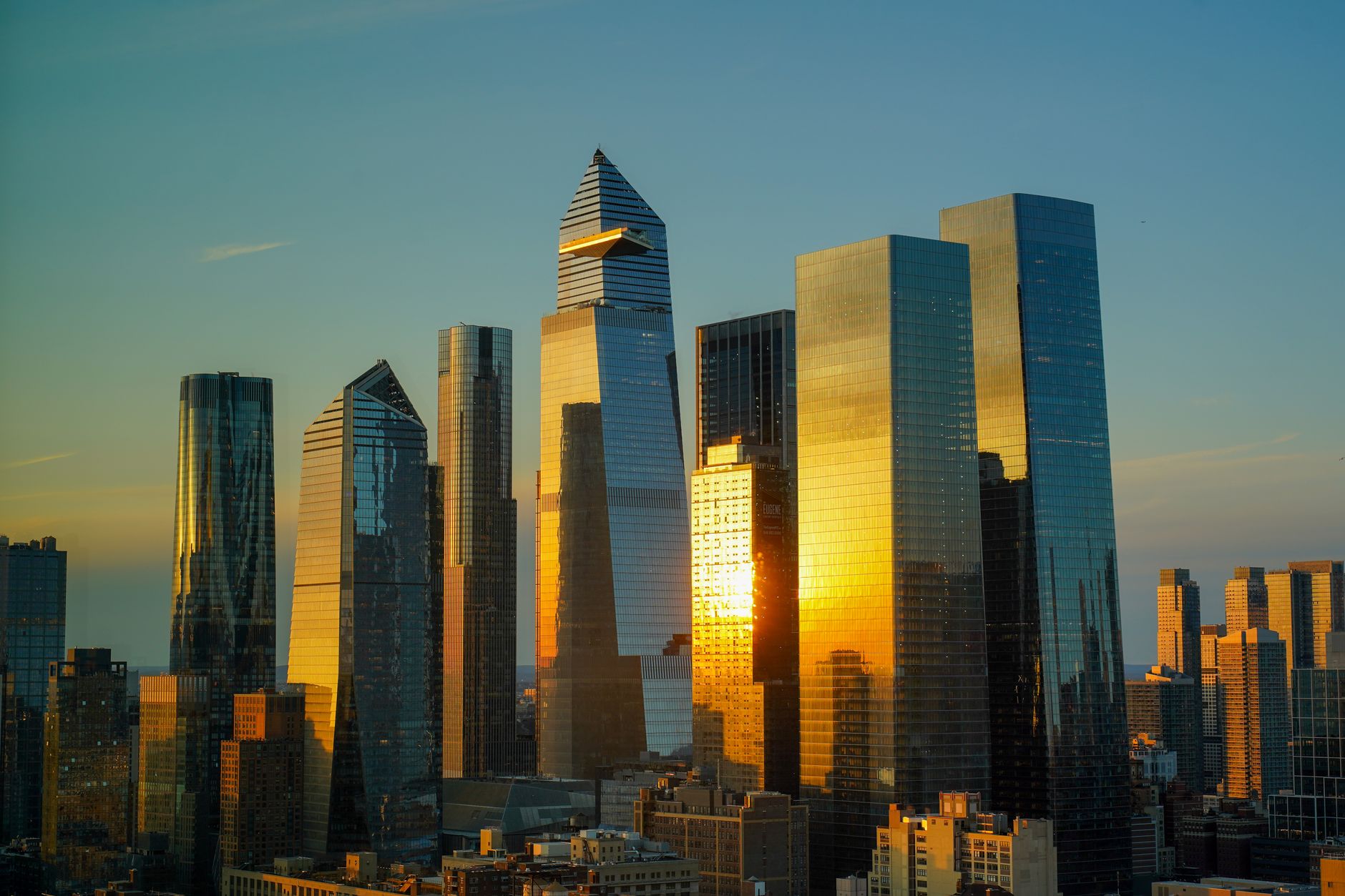 Modern NYC commercial buildings and skyscrapers with glass facades reflecting city skyline
