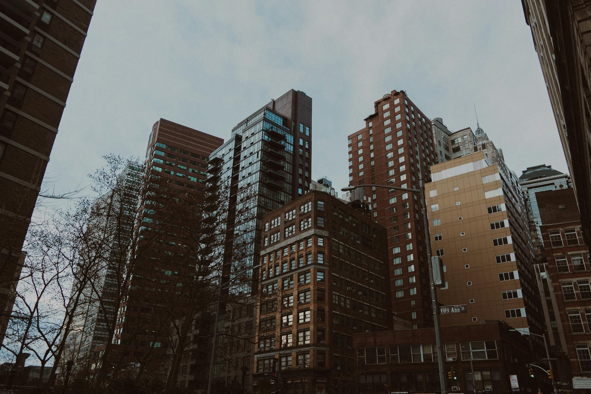 Modern multifamily apartment buildings in Brooklyn and Queens neighborhoods with street-level retail