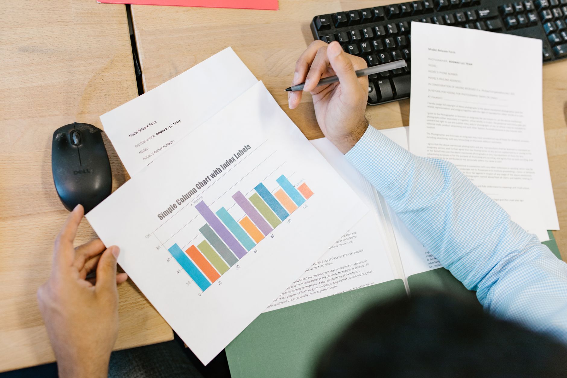 Real estate professional analyzing financial data and property metrics on computer during underwriting process