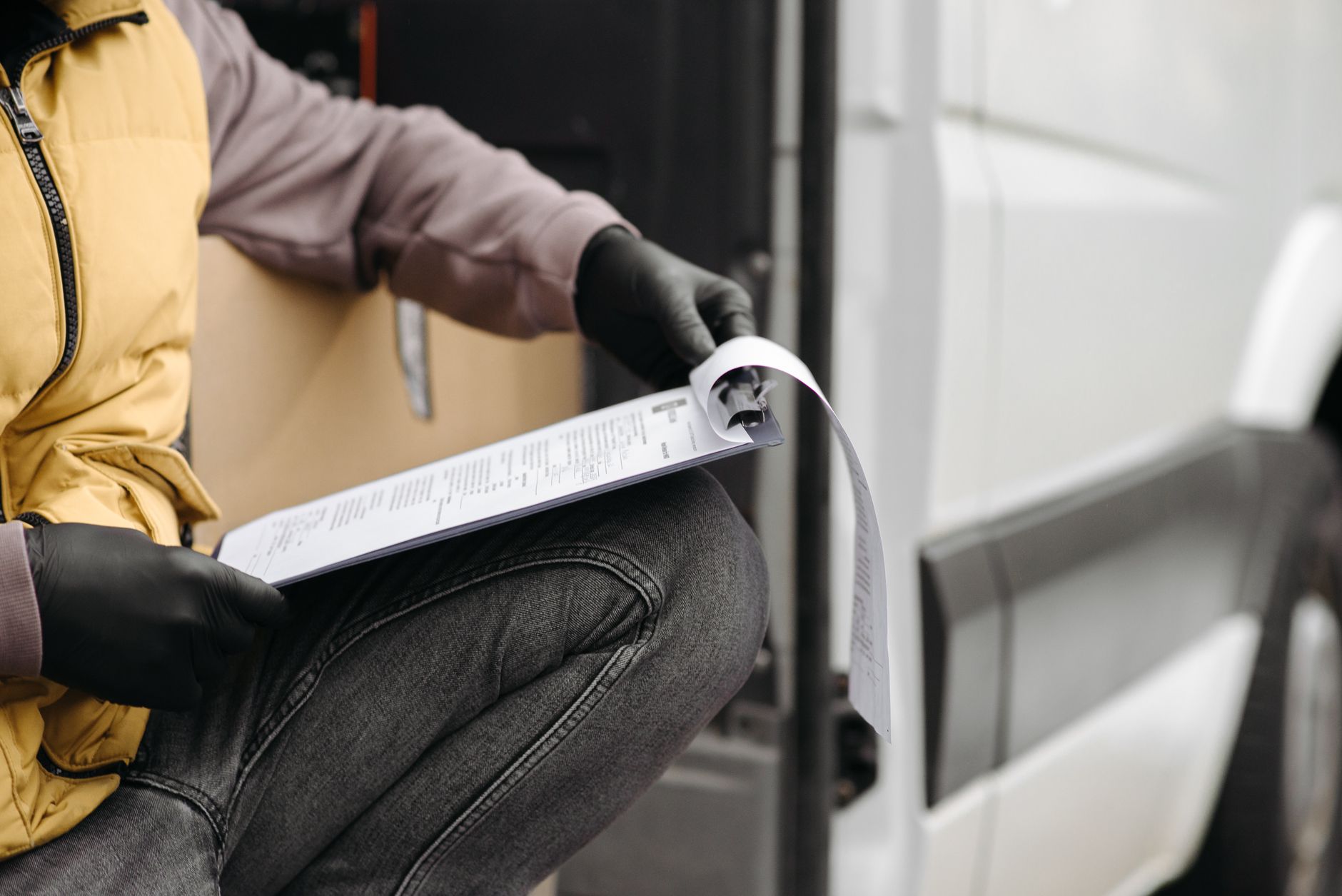 Professional gate contractor reviewing official documents and CSLB license paperwork