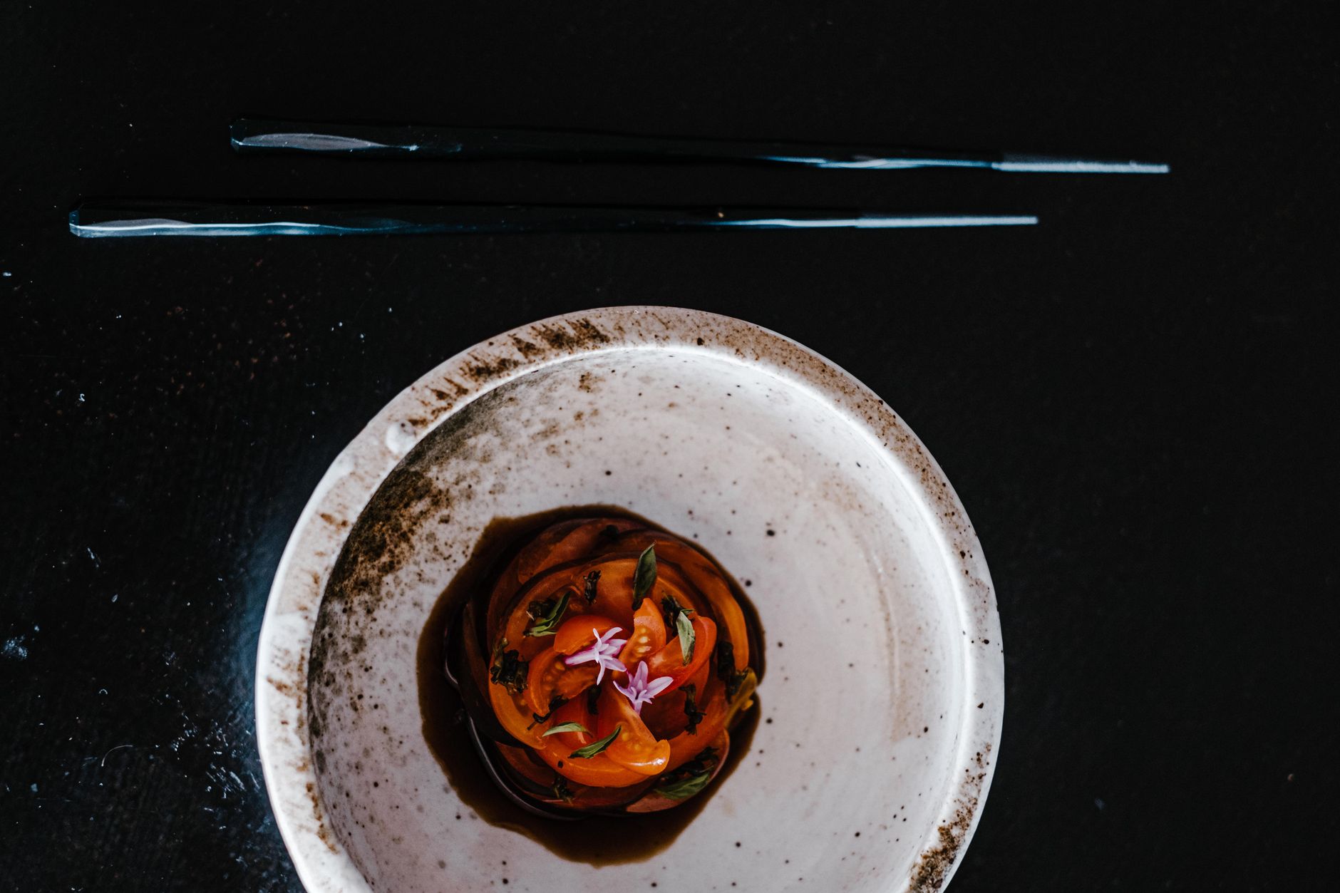 Elegantly plated Korean fusion dish served in an intimate, modern Manhattan restaurant setting
